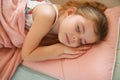 Little girl napping on couch. Royalty Free Stock Photo