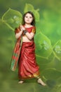 A little girl is in the national Indian dress