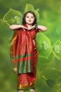 A little girl is in the national Indian dress