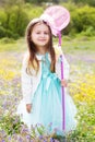 Little girl on the nature with butterfly net Royalty Free Stock Photo