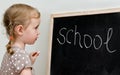 Little girl near blackboard Royalty Free Stock Photo