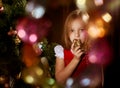 Little girl near Christmas tree