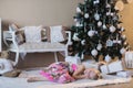 Little girl near the Christmas tree had fallen sleep waiting for Santa, the preparation for the holiday, packaging, boxes, Christm Royalty Free Stock Photo