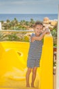 Little girl near water park slides Royalty Free Stock Photo