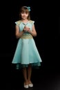 Little girl in a New Year costume with a candle. Royalty Free Stock Photo