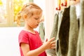 Little girl in nursery school using towel in bathroom Royalty Free Stock Photo