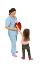 Little girl offering heart to doctor
