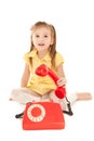 Little girl with old red phone Royalty Free Stock Photo