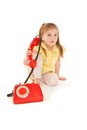 Little girl with old red phone Royalty Free Stock Photo