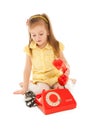Little girl with old red phone sitting on the floor Royalty Free Stock Photo