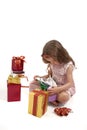 Little girl opening her Christmas presents Royalty Free Stock Photo