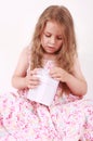 Little girl opening present