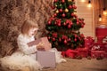 Little girl opens magic Christmas gift box Royalty Free Stock Photo