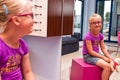 Little girl in an optician shop Royalty Free Stock Photo