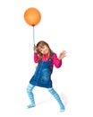 Little girl with orange balloon