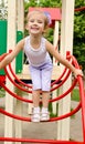 Little girl on outdoor playground equipment Royalty Free Stock Photo