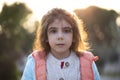 Little girl outdoor portrait with sunlight