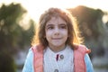 Little girl outdoor portrait with sunlight