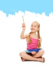 Little girl painting with blue paint Royalty Free Stock Photo