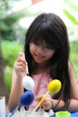 Little girl is painting egg Royalty Free Stock Photo