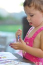 Little girl painting hand