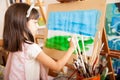 Little girl painting a landscape Royalty Free Stock Photo