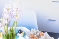 Little girl paints eggs for Easter in the kitchen at home. Child and holiday items of spring. A happy child draws. Copy space Royalty Free Stock Photo