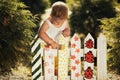 Little girl paints a fence Royalty Free Stock Photo