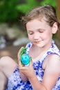 Little Girl Paints Her Easter Egg