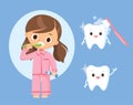 Little girl in pajamas brushing teeth with toothpaste