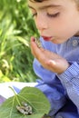 Little girl palying with silkworm in hands Royalty Free Stock Photo