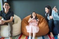 Little girl and parent family playing video game at home. Royalty Free Stock Photo