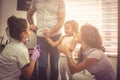 Little girl with parents at female dentist.