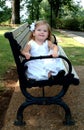 Little Girl on Park Bench Royalty Free Stock Photo
