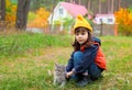 Little girl pats the cat Royalty Free Stock Photo