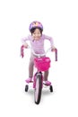 Little girl pedaling bicycle Royalty Free Stock Photo