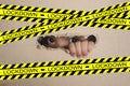 Little girl peeking from a hole on cardboard box with lockdown sign. selective focus on her eye.