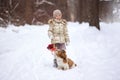 Little girl with pet dog for a walk