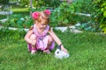 Little girl petting a bunny