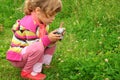 Little girl with photo camera outdoor Royalty Free Stock Photo