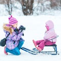 Little girl photographed her sister