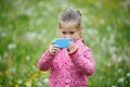 Little girl photographing with her smart phone Royalty Free Stock Photo