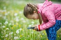 Little girl photographing with her smartphone Royalty Free Stock Photo