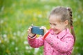 Little girl photographing with her smartphone Royalty Free Stock Photo