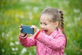 Little girl photographing with her smartphone Royalty Free Stock Photo