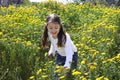 Little girl picking flowers