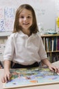 Little Girl With A Picture Puzzle Royalty Free Stock Photo