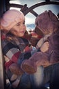 Little girl in a pink beret sits Royalty Free Stock Photo