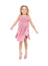 Little Girl in a Pink Dress Jumping Royalty Free Stock Photo