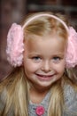 Little girl in pink headphones